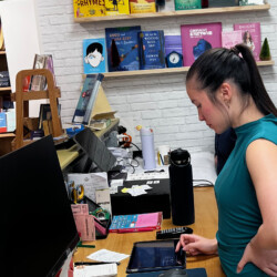 Anna Kolosky running sound for Walter Kolosky's Author Event, hosted by Ten Trees Books.